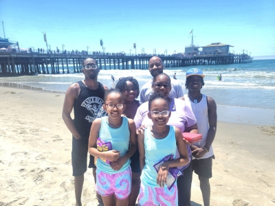 Karma and Kiani with family on beach