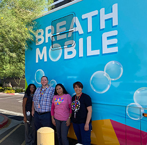 Breathmobile Staff Image Next to the Bus