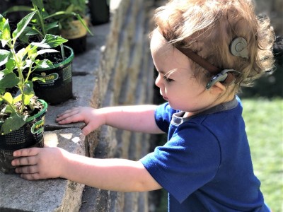 Toddler wearing cochlear implant