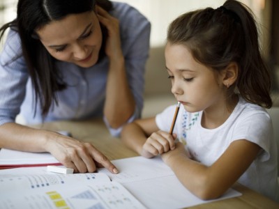 Parent and child working on schoolwork