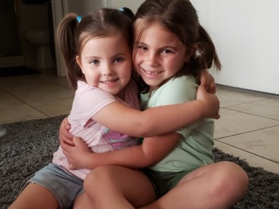 Two sisters hugging