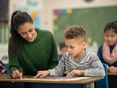 Student and teacher in classroom setting
