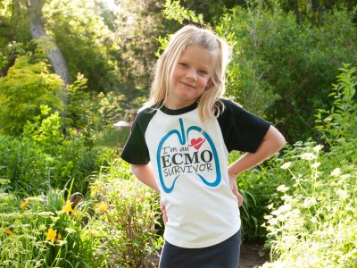 Young girl posing in greenery