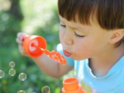 Child blowing bubbles