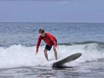 Teen boy surfing