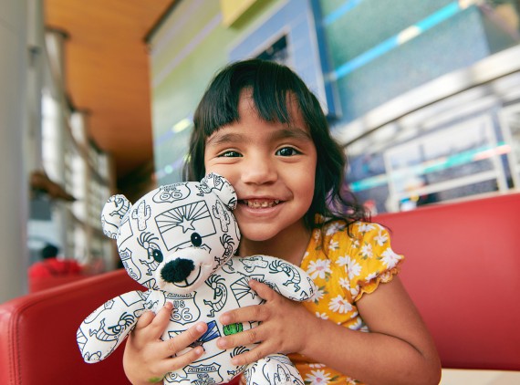 cute girl holding bear
